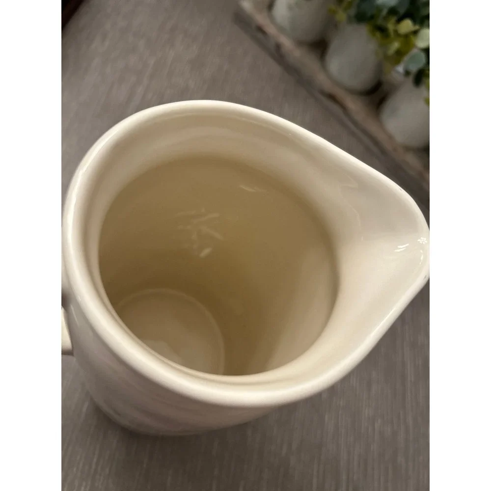 Rae Dunn ceramic pitcher featuring the‎ word 
